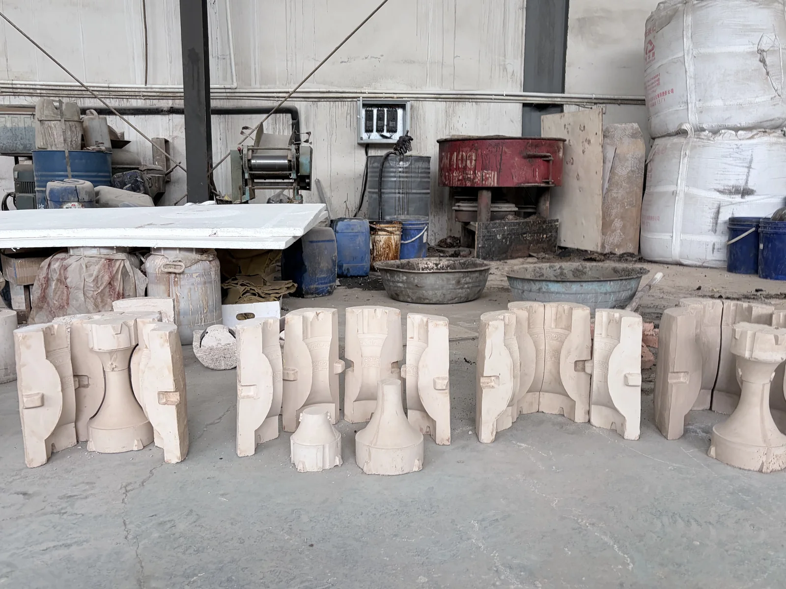 Sectional mold forms visible during a workshop visit