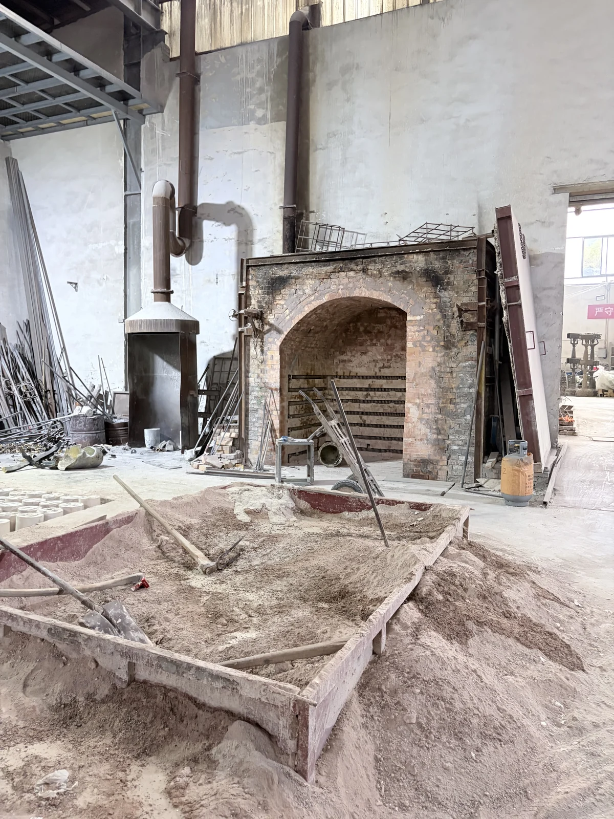 Mold-related forms and work surfaces in a bronze workshop