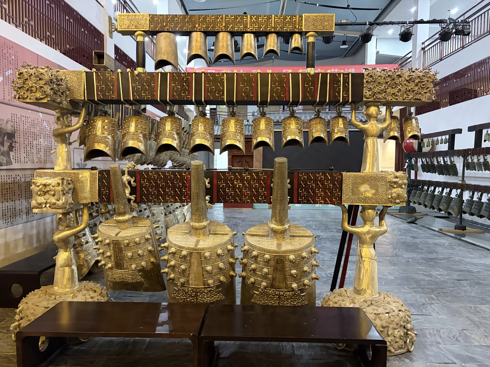 Bronze bells and musical-instrument forms in the workshop showroom