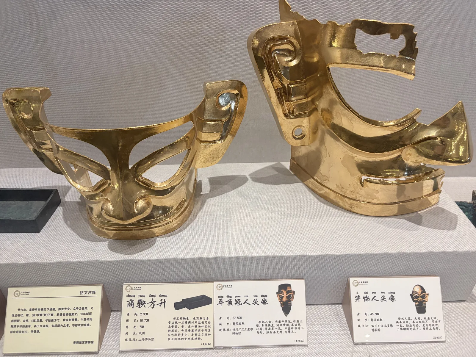 Gold-finish bronze vessel forms in the workshop showroom